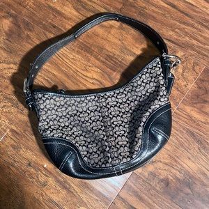 Small coach monogrammed purse.
